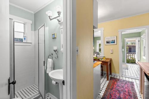 a bathroom with a sink and a toilet at Charming 1923 Cottage at Erehwon Retreat in Tampa