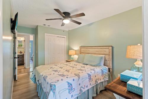 a bedroom with a bed and a ceiling fan at #51 Superior Condo Ideal Location Pool 3BDR/2 Park in Hilton Head Island