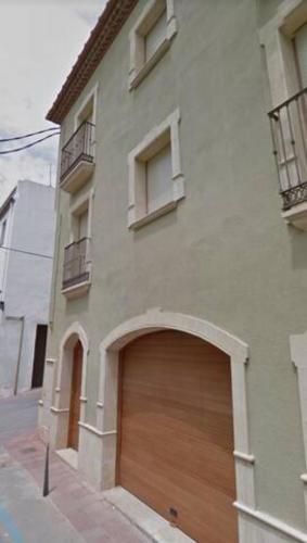 a large building with a garage door at Apt Costa Dorada 1 by MarCalma in Creixell