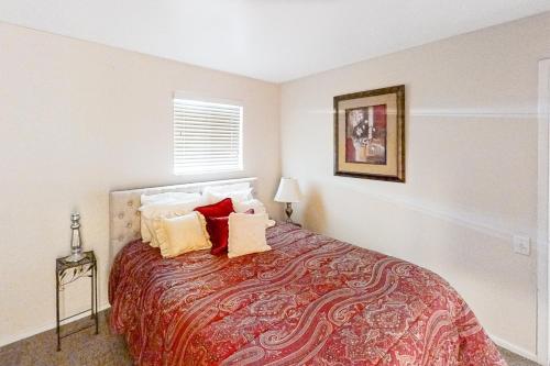 a bedroom with a large bed with pillows on it at Riverfront Retreat in Nashville