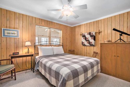 a bedroom with a bed and a ceiling fan at Johnson Cottage in Glenn