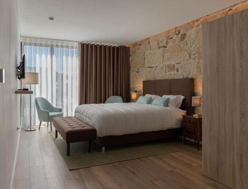Un pat sau paturi într-o cameră la Quinta da Moita Agroturismo