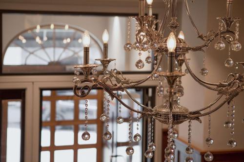 a chandelier is hanging in front of a door at Bergen Harbour Hotel, WorldHotels Crafted in Bergen