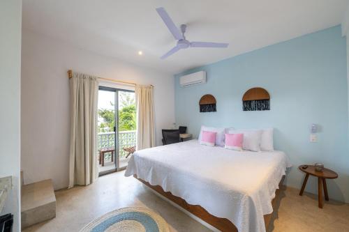 Giường trong phòng chung tại Casa Ikal
