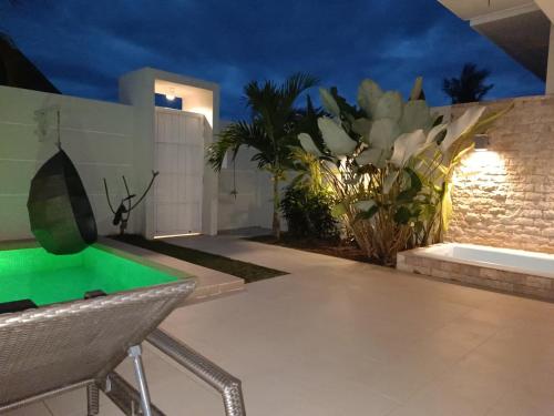 a house with a pool table in a yard at Pineale Villas, Resort and Spa in Panglao