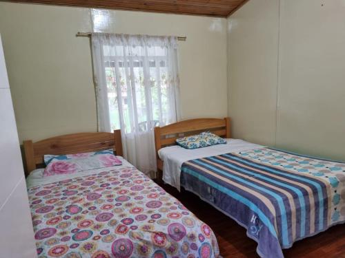 Postel nebo postele na pokoji v ubytování Cabañas 4 Caminos