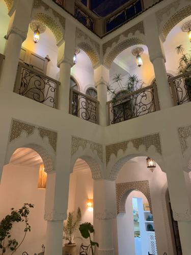 a building with arched ceilings and a balcony at Riad Dollar Des Sables & Spa in Marrakesh
