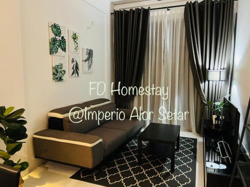 a living room with a couch and a window at Imperio Professional Suites @ FD Homestay in Alor Setar