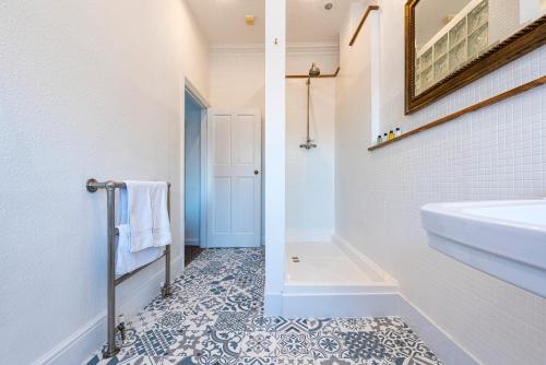 a bathroom with a sink and a bath tub at Riverside Rest in Ollerton