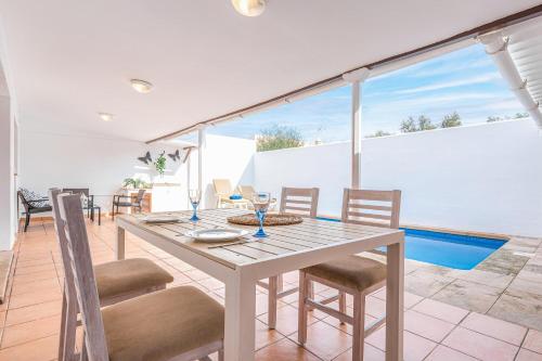 a dining room with a table and chairs at Sestanyolet in Llucmajor