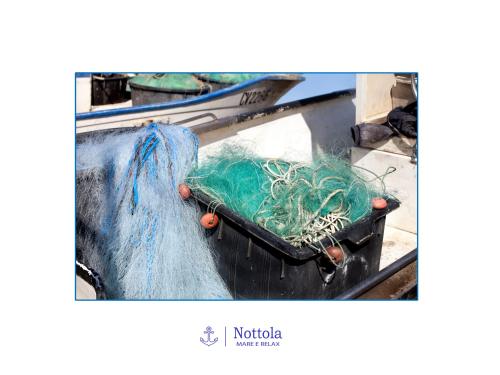 a suitcase full of nets on a boat at Nottola B&B in Ladispoli
