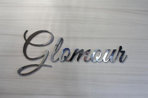 a sign that says gemini written in cursived handwriting at B&B Bellavista Exclusive in zona centrale con piscina riscaldata e Jacuzzi vista lago LA COLAZIONE viene servita in una pasticceria rinomata ed esclusiva esterna alla struttura in Desenzano del Garda