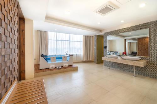 a bathroom with two sinks and a large mirror at PrideInn Azure Hotel Nairobi Westlands in Nairobi