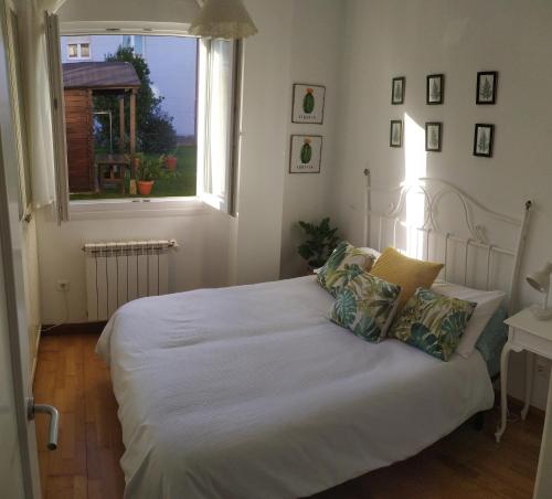 Un pat sau paturi într-o cameră la Apartamento el Haya