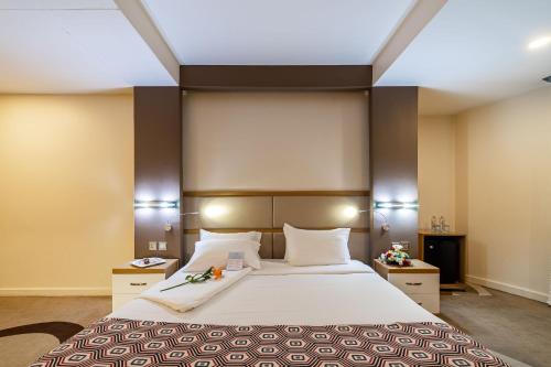 a bedroom with a large bed in a room at PrideInn Azure Hotel Nairobi Westlands in Nairobi