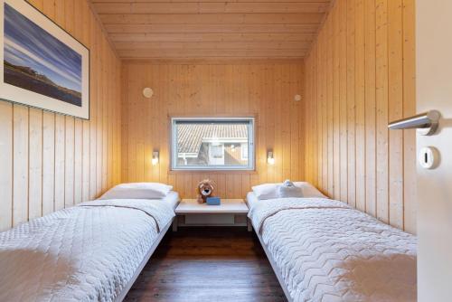 En eller flere senge i et værelse på Hof Ruhleben Haus Muschelsucher