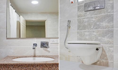 a bathroom with a toilet and a sink at Treebo Elite City Upper Bazar in Rānchī