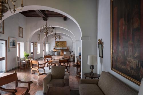 a living room with a couch and chairs and a table at Parador de Guadalupe in Guadalupe