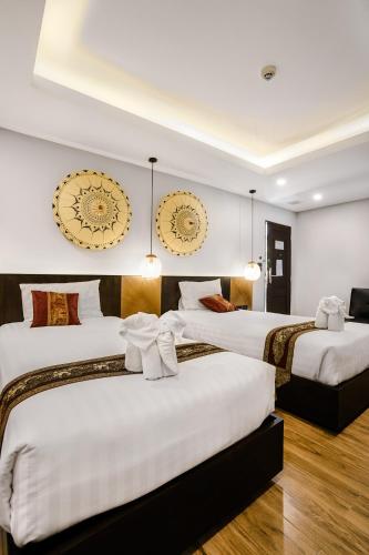 Katil atau katil-katil dalam bilik di Paraiso Hotel Chiangmai