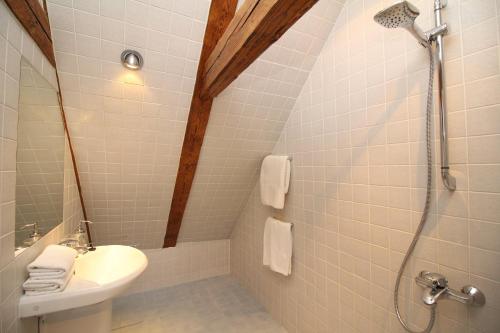 a bathroom with a shower and a toilet and a sink at Tallinn City Apartments 2 bedroom & 2 bathroom luxury property with balcony in Old Town in Tallinn