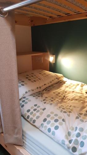 two bunk beds in a bedroom with at Heart of Glencoe Holidays in Glencoe