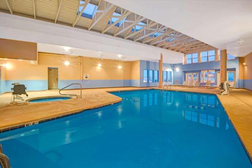 a large pool with blue water in a building at Hotel 505 in Albuquerque