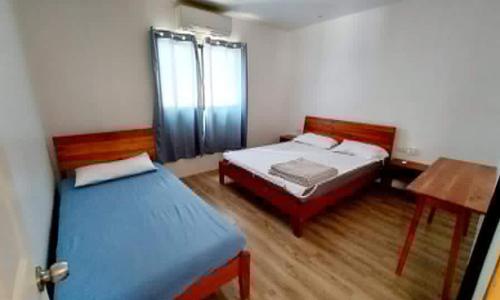 Katil atau katil-katil dalam bilik di Positano Alona Beach Panglao