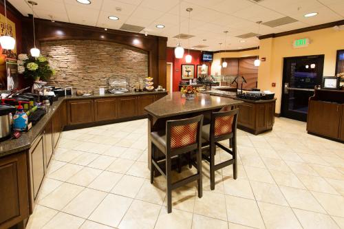a large kitchen with a large island in a restaurant at Staybridge Suites North Charleston by IHG in Charleston