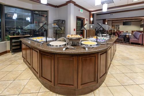 a large island in a lobby with a buffet at Staybridge Suites North Charleston by IHG in Charleston