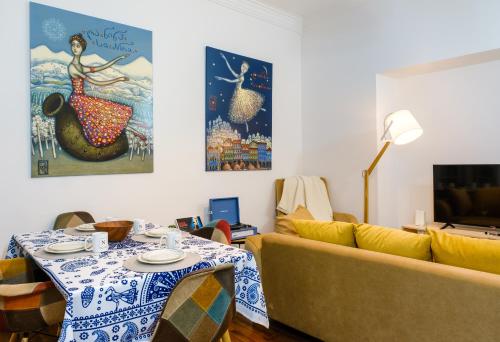 a living room with a couch and a table at BB Residence Sololaki in Tbilisi City