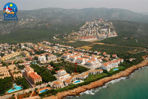 an aerial view of a city next to the water at Apartamentos Hibiscus Casa Azahar in Alcossebre