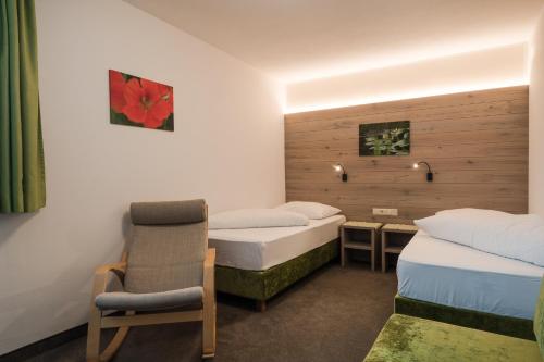 Postel nebo postele na pokoji v ubytování Hotel & Residence Rebhof