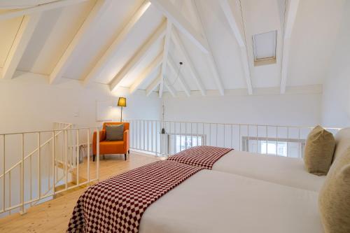 Un pat sau paturi într-o cameră la YOUROPO - Taipas