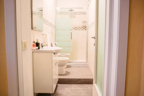 a bathroom with a sink and a toilet at Netflix - Centro Storico Urbino in Urbino