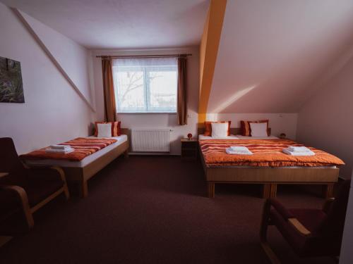 Llit o llits en una habitació de Pelikan Purkarec