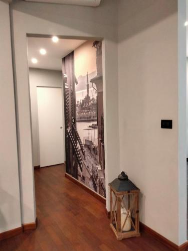 a hallway with a painting of the eiffel tower at Casa di Ravecca in Genova