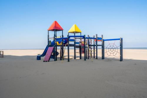 a playground in the sand on the beach at Kindvriendelijk app met frontaal zeezicht &garage in Koksijde