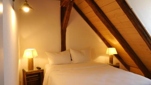 Posteľ alebo postele v izbe v ubytovaní Pension & Café Schlupfwinkel