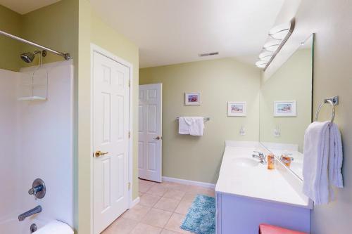 a bathroom with a sink and a mirror at Salt Pond -- 13 Skipjack Village in Bethany Beach