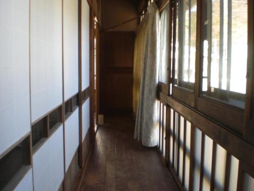an empty hallway with windows in a building at Marina bay Numazu マリーナベイ沼津 BBQ可 in Numazu