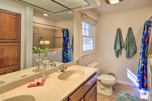 a bathroom with a sink and a toilet at Lakefront Kingsport Home with Private Hot Tub! in Kingsport