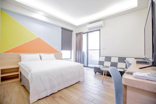 Postel nebo postele na pokoji v ubytování WOW Penghu Homestay