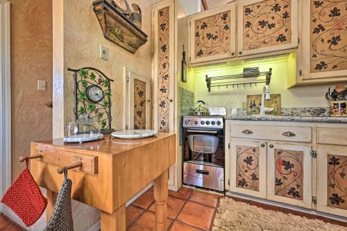 a kitchen with a wooden table and a stove at Vineyard Views and Sauna at Cornville Home! in Cottonwood