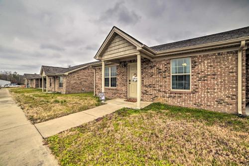 a brick house with a sidewalk in front of it at Quaint Family Home Near Downtown Murray and MSU in Murray