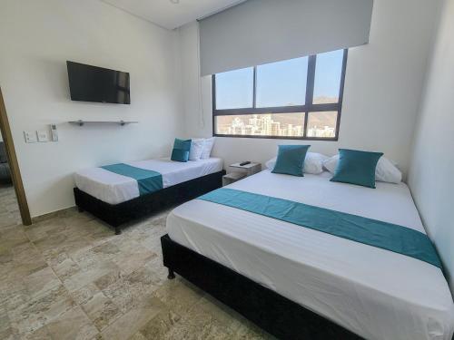 Photo de la galerie de l'établissement Apartasuites VITA 945 RODADERO - By Bedviajes, à Santa Marta