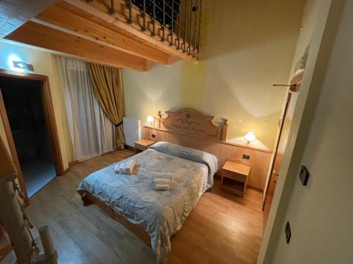 Postel nebo postele na pokoji v ubytování Hotel Sole del Baldo