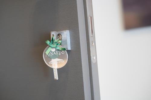 a key on a door with a picture on it at Fronte Etna in Bronte