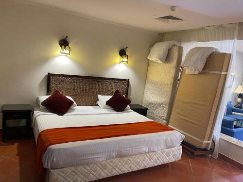 a bedroom with a bed and two bunk beds at Patio suite, Porto marina in El Alamein