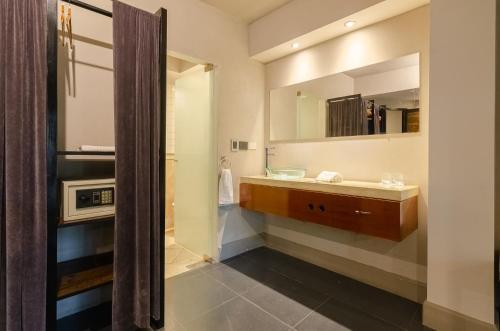 a bathroom with a sink and a mirror at Prodeo Hotel + Lounge in Buenos Aires