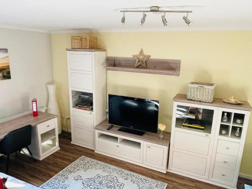 TV a/nebo společenská místnost v ubytování Eine charmante Wohnung wartet auf Sie